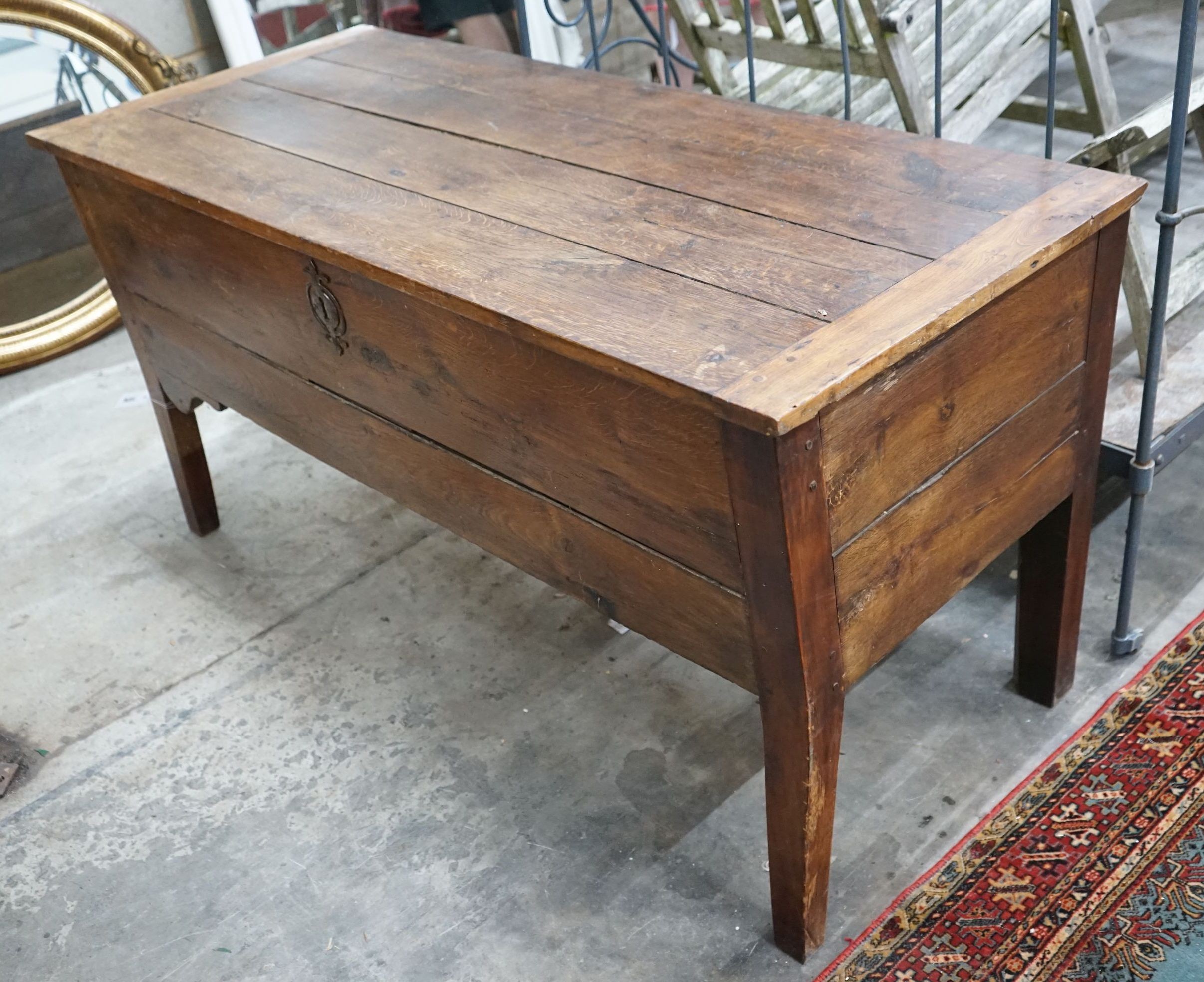 An early 19th century continental oak hinged top dough bin, width 145cm, depth 62cm, height 73cm